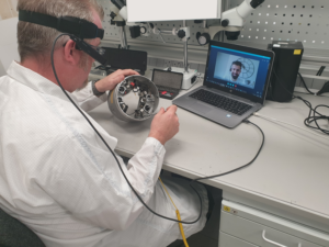 Engineer wearing Smart Glasses whilst working with a designer over a Skype video call.