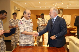 Qatari naval commander Major General Mohammed Nasser Al Mohannadi and Managing Director MBDA Italia Antonio Perfetti shake hands after the contract signature